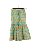 Green skirt with orange floral pattern on a hanger against a white background