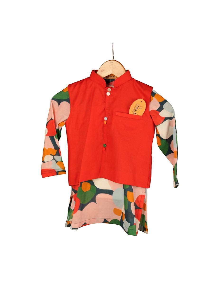 Red shirt with floral sleeves and pants on a hanger against a white background