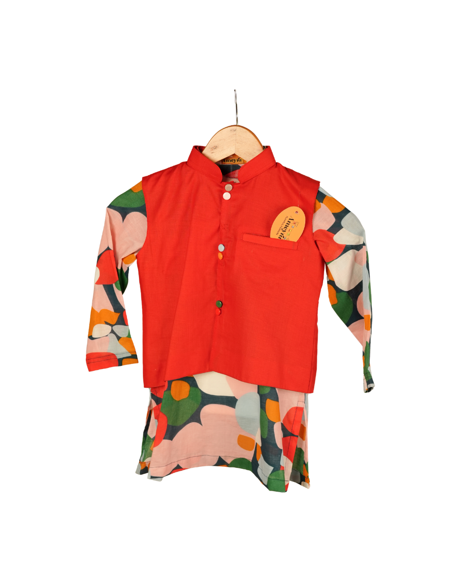 Red shirt with floral sleeves and pants on a hanger against a white background