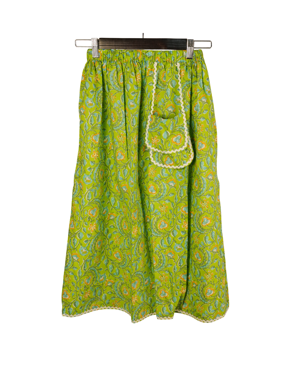 Green patterned skirt with a white background