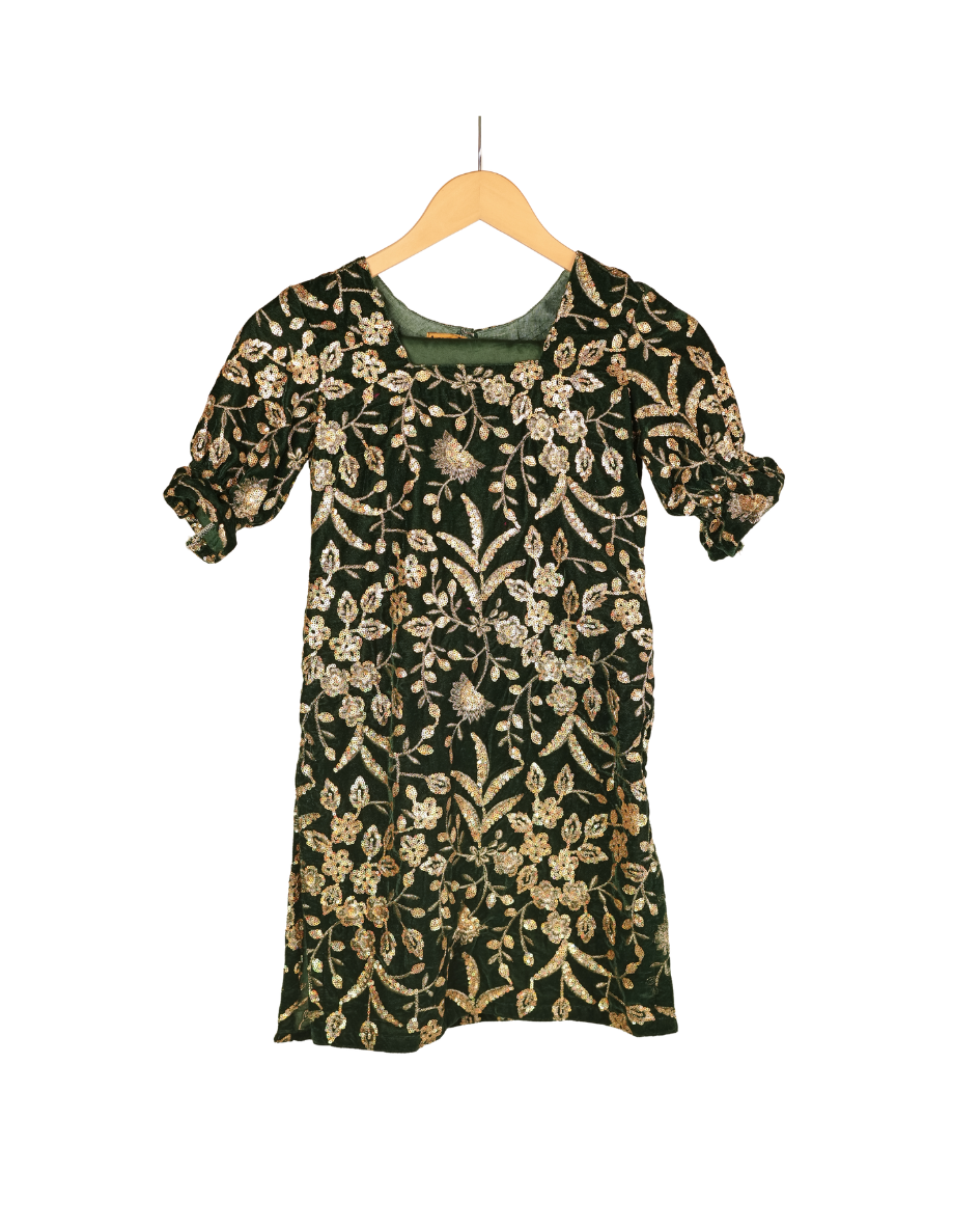 Floral patterned dress on a wooden hanger against a white background