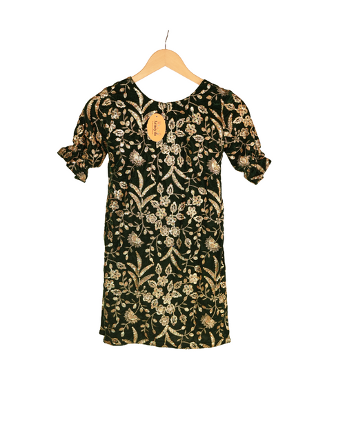 Black dress with gold floral pattern on a hanger against a white background