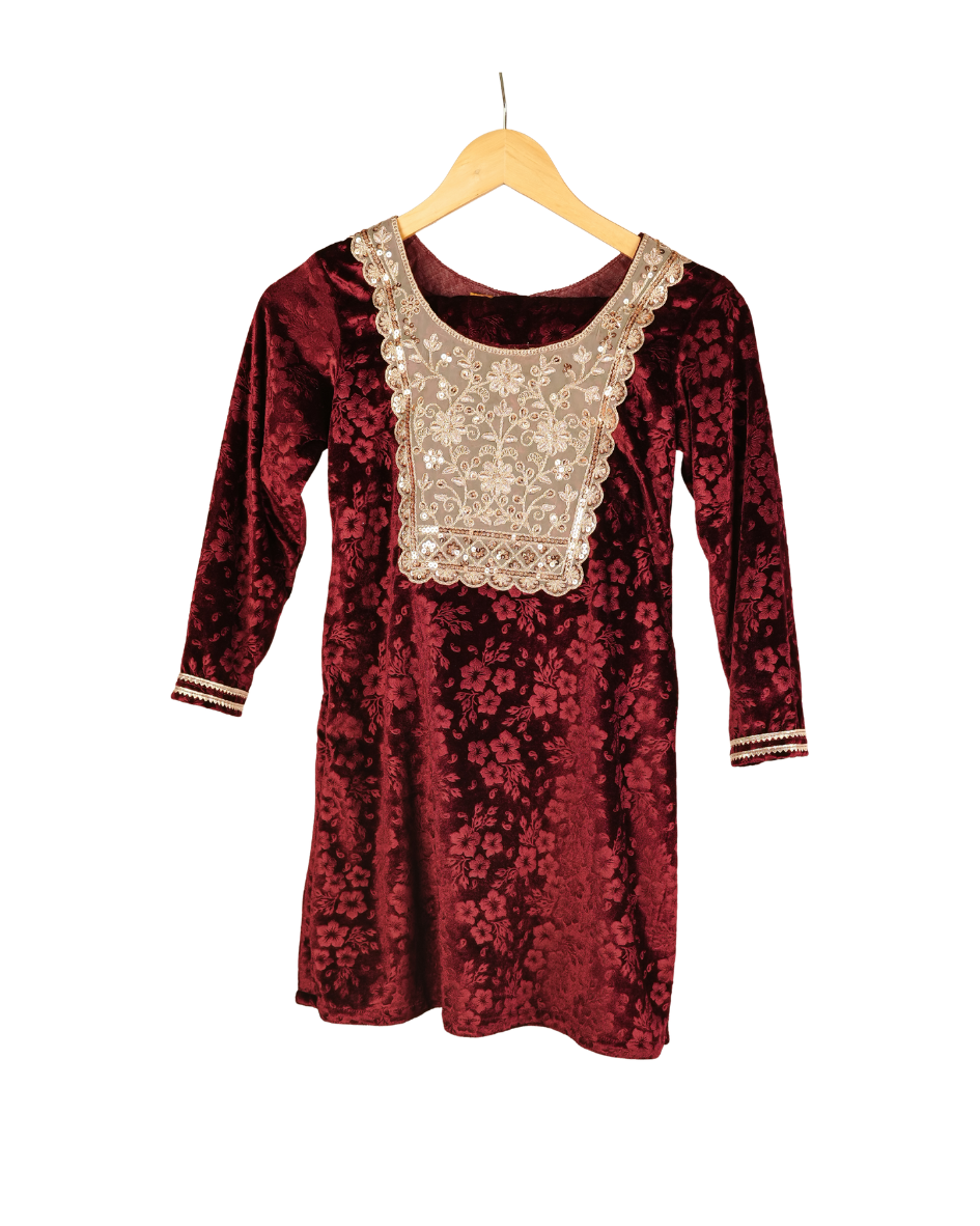 Red floral dress with lace neckline on a hanger against a white background