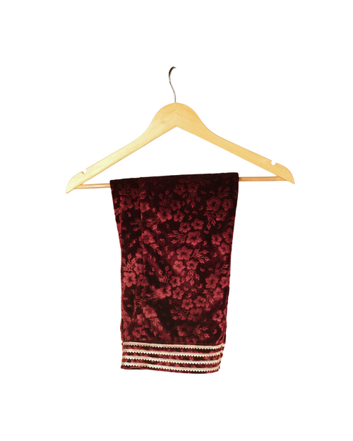 Red patterned scarf on a wooden hanger against a white background