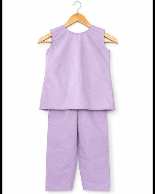 Purple sleeveless top and pants set on a hanger against a white background
