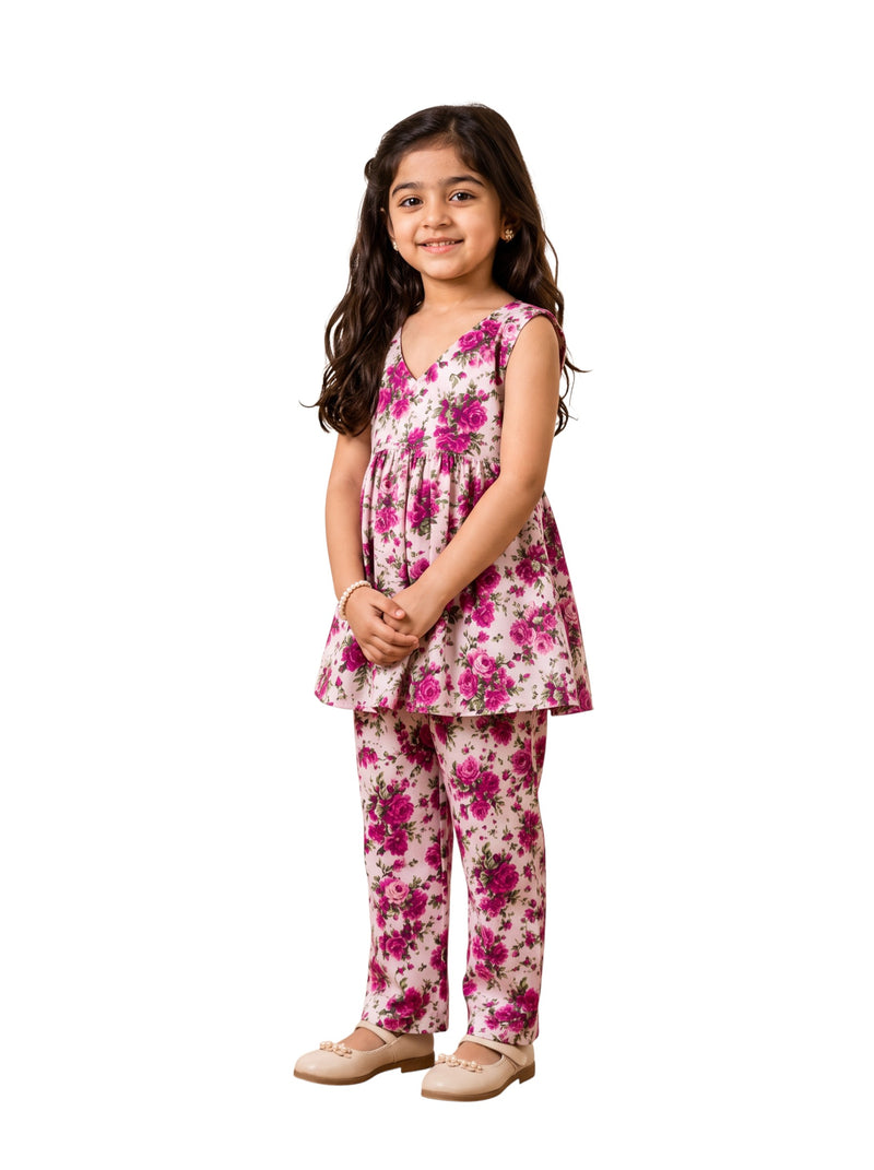 Ameyru Kids Wear girl wearing a sleeveless floral peplum top and matching straight-leg pants in pink and white