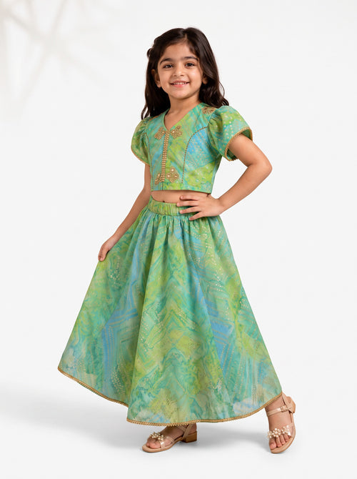 Ameyru Kids Wear green and blue printed lehenga choli with puff sleeves and gold embroidery for festive occasions