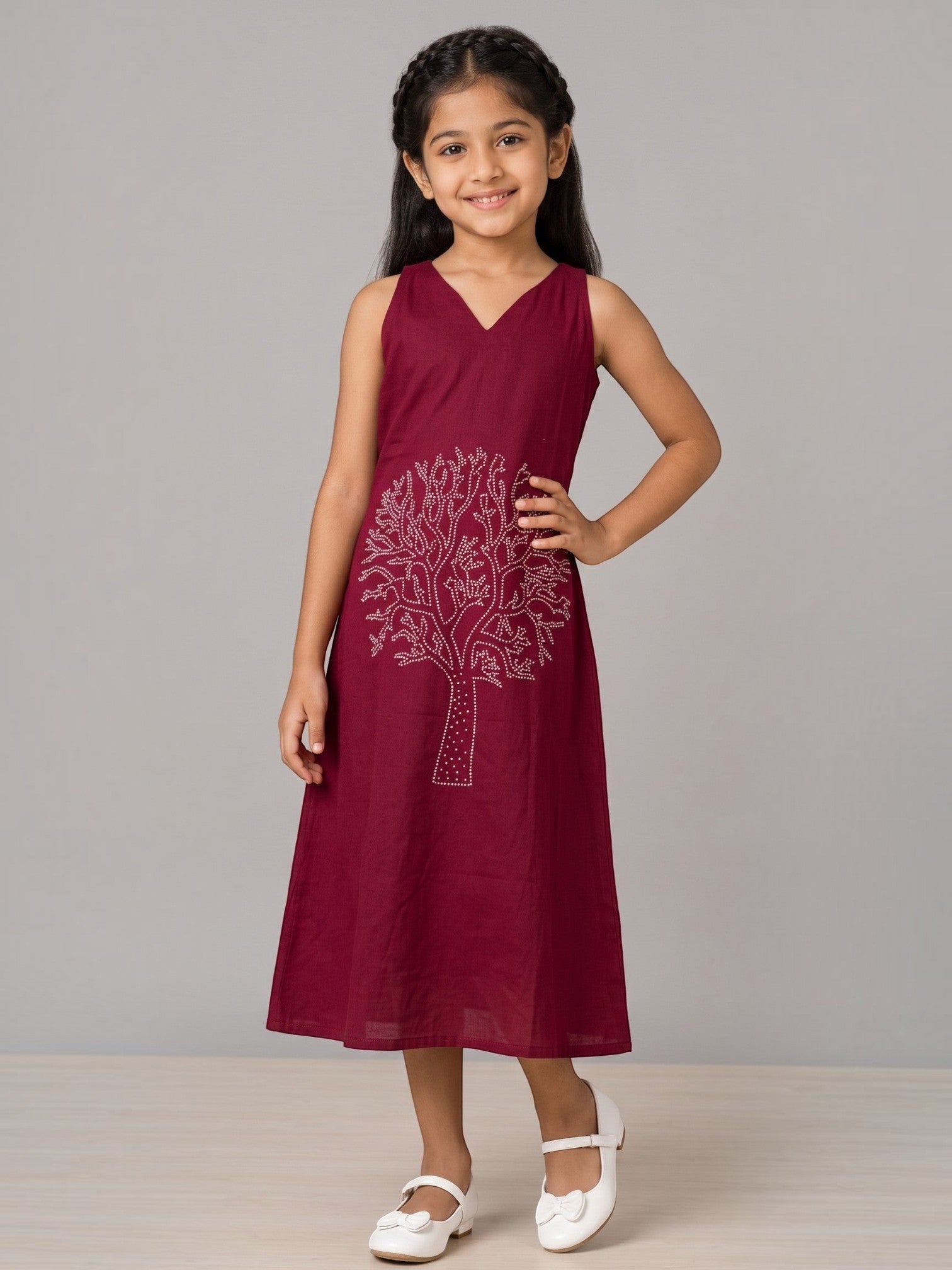 Ameyru Kids Wear maroon sleeveless A-line dress with a shimmering tree motif worn by a young girl