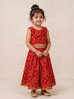 Ameyru Kids Wear red ethnic lehenga choli with gold bandhani patterns and trim on a young girl
