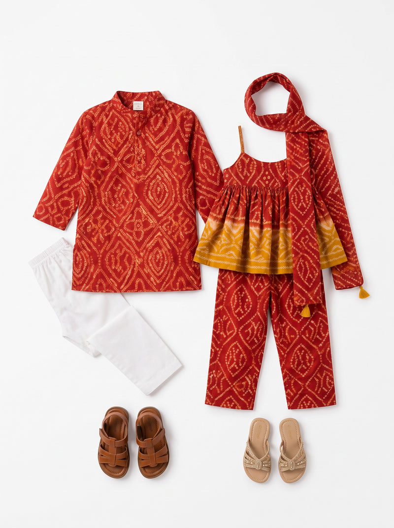 Ameyru Kids Wear traditional red ethnic set for boys and girls with intricate patterns, white trousers, and sandals.