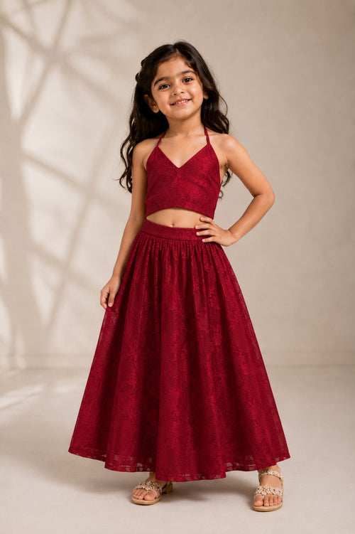 Ameyru Kids Wear girl in a deep red lace crop top and matching long skirt lehenga set for festive occasions.