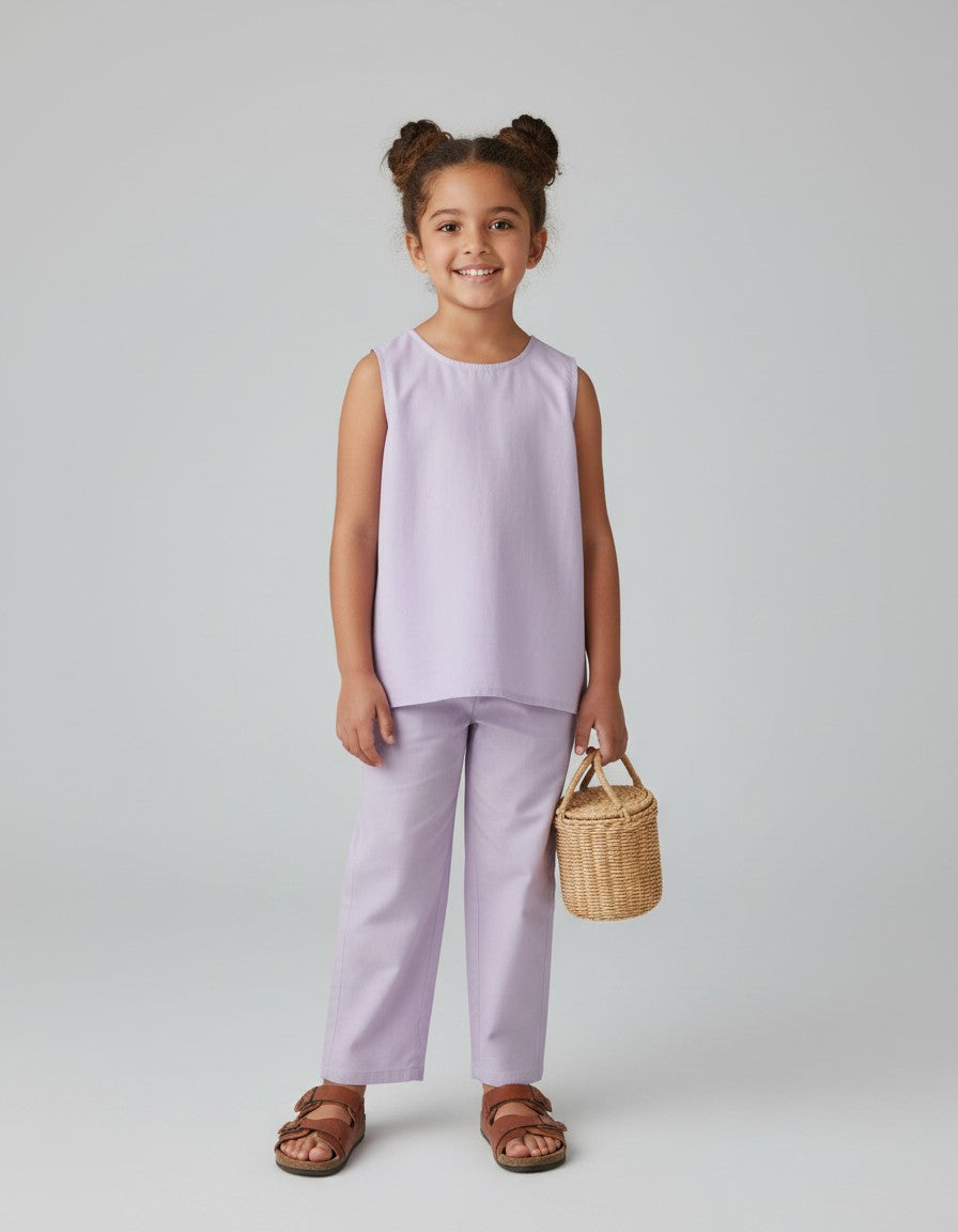 Baby Kids Cloths Ameyru lavender pure cotton co-ord set worn by a smiling girl with a small woven basket bag
